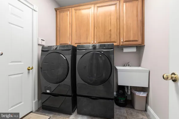 a room with gym equipment and a flat screen tv