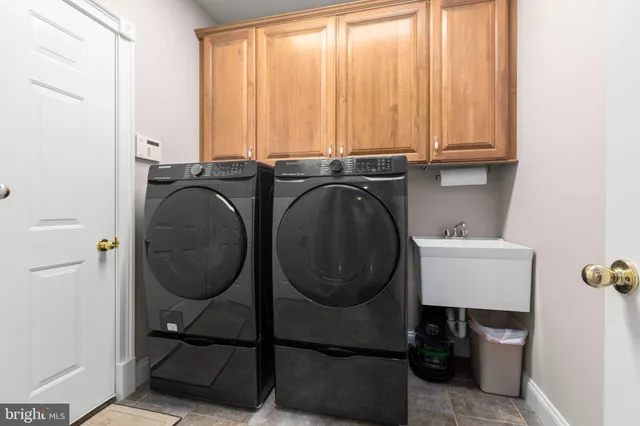 a room with gym equipment and a flat screen tv