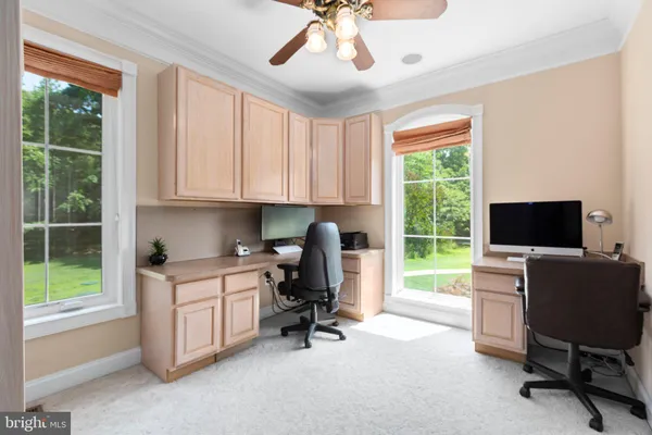 a room with furniture pool table and flat screen tv