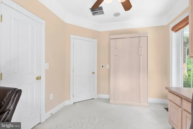 a spacious bathroom with a granite countertop sink and a mirror