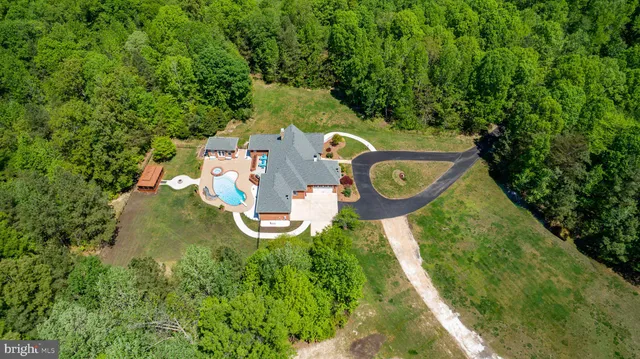 a view of a big yard with lots of green space and deers