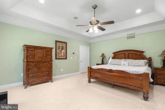 an aerial view of a house with swimming pool patio and outdoor seating