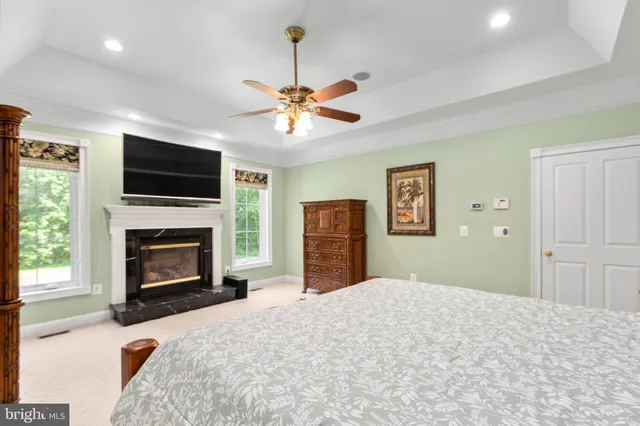 a view of yard with swimming pool outdoor seating and green space