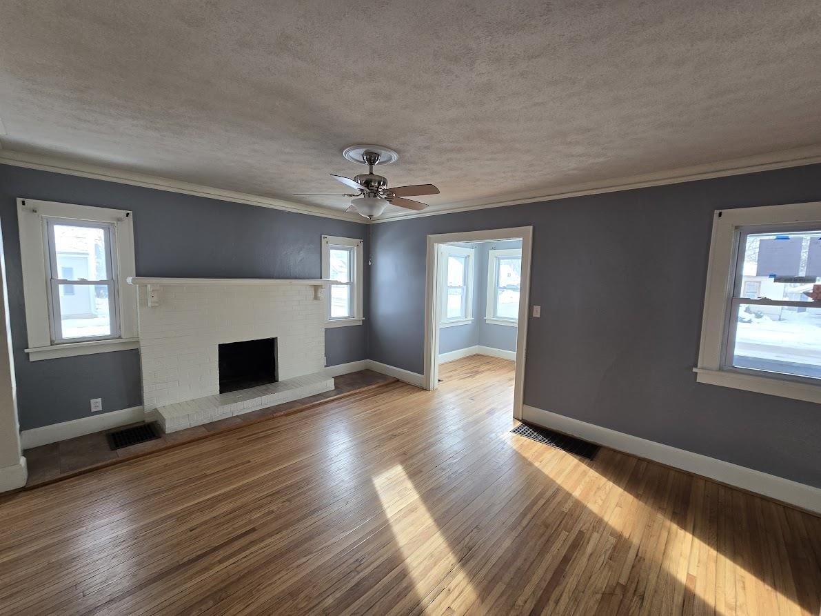 2103 North Court Street Rockford, IL 61103 - Photo 3 of 14 a view of an empty room with wooden floor and a window