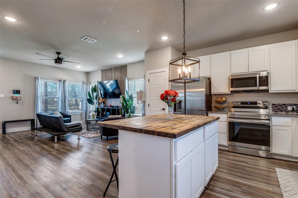 1205 Edgar Street Greenville, TX 75401 - Photo 11 of 26 a kitchen with sink stove and refrigerator