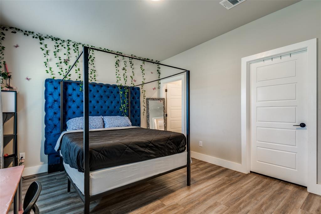 1205 Edgar Street Greenville, TX 75401 - Photo 16 of 26 a bedroom with a bed and a window
