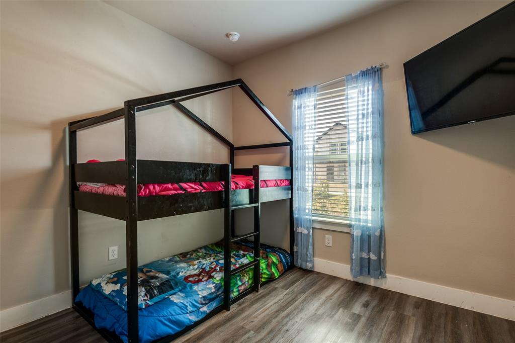1205 Edgar Street Greenville, TX 75401 - Photo 20 of 26 a bedroom with wooden floor