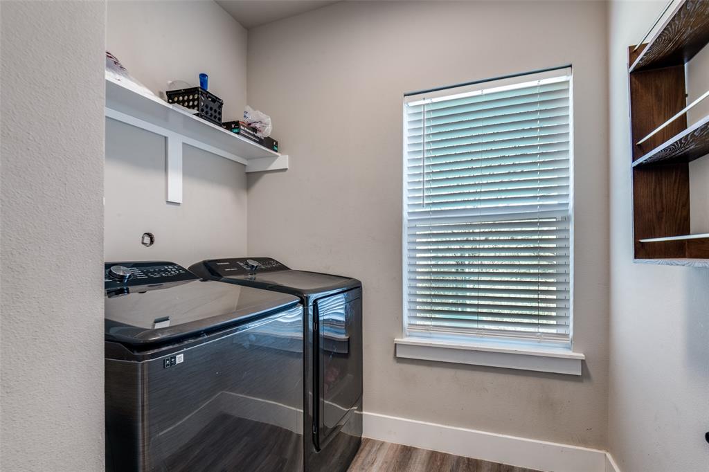 1205 Edgar Street Greenville, TX 75401 - Photo 23 of 26 a utility room with a sink a washer and dryer