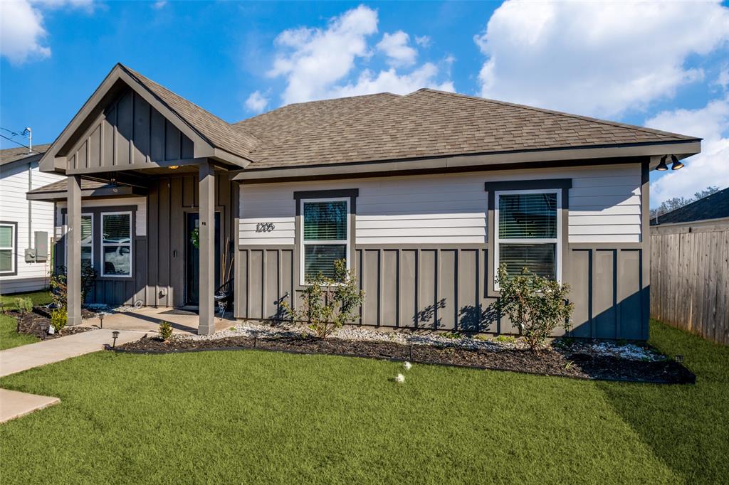 1205 Edgar Street Greenville, TX 75401 - Photo 3 of 26 a front view of a house with a yard