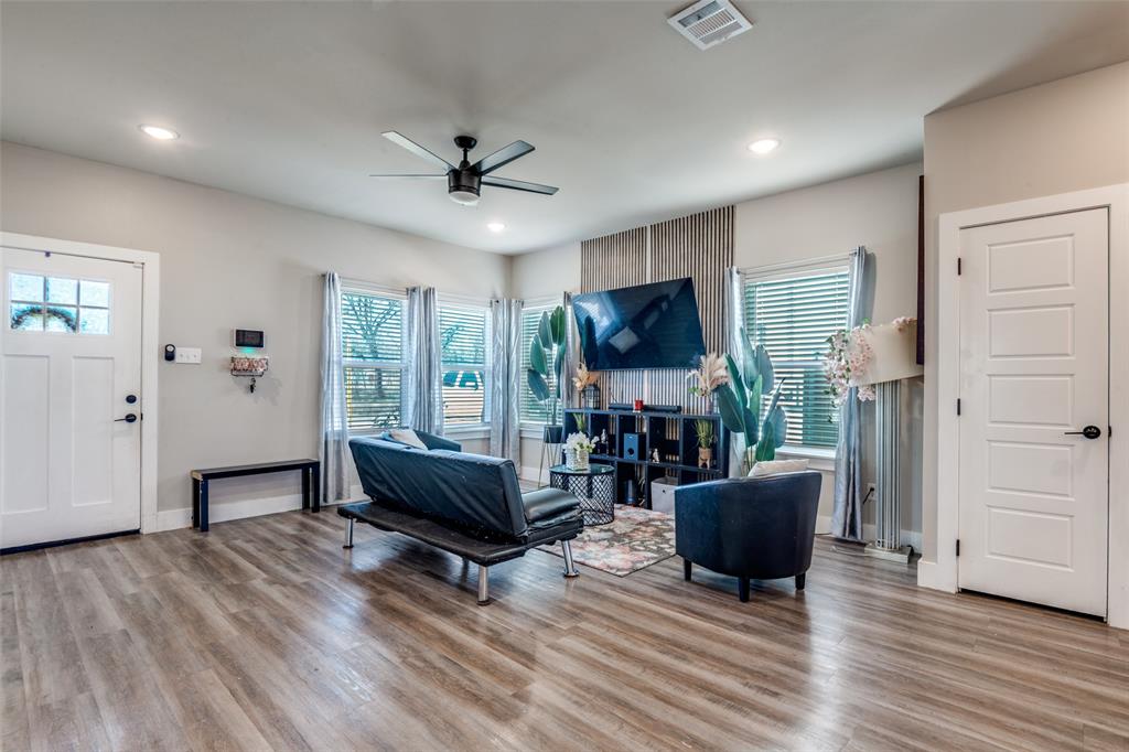 1205 Edgar Street Greenville, TX 75401 - Photo 5 of 26 a living room with furniture and a flat screen tv