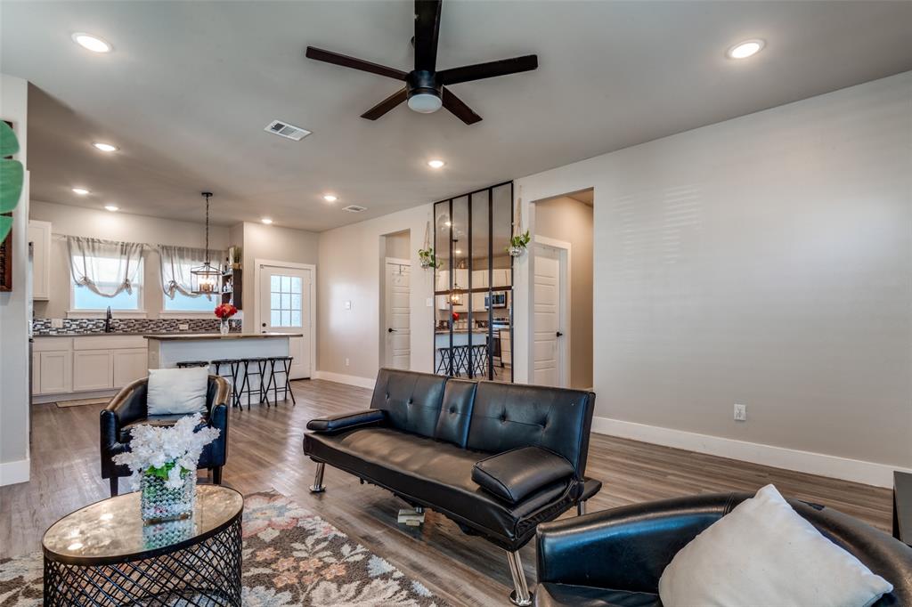 1205 Edgar Street Greenville, TX 75401 - Photo 7 of 26 a living room with furniture and a wooden floor