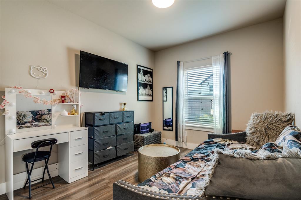 1205 Edgar Street Greenville, TX 75401 - Photo 9 of 26 a living room with furniture and a flat screen tv