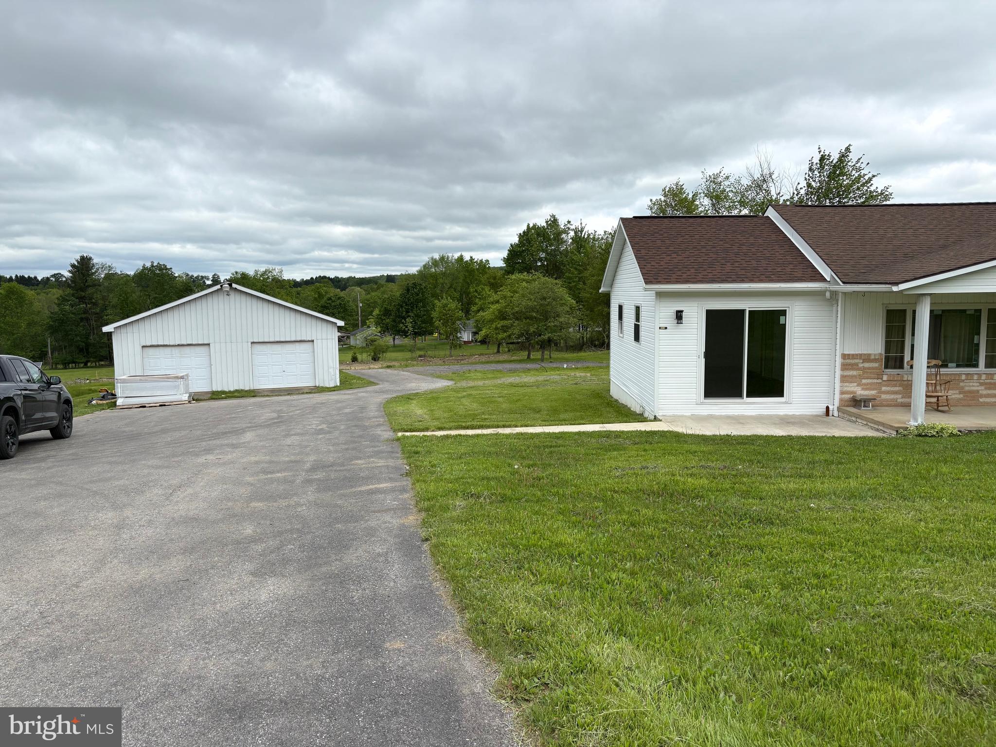 4319 Viola Pike Ramey, PA 16671 - Photo 21 of 23 a front view of a house with a yard and garage