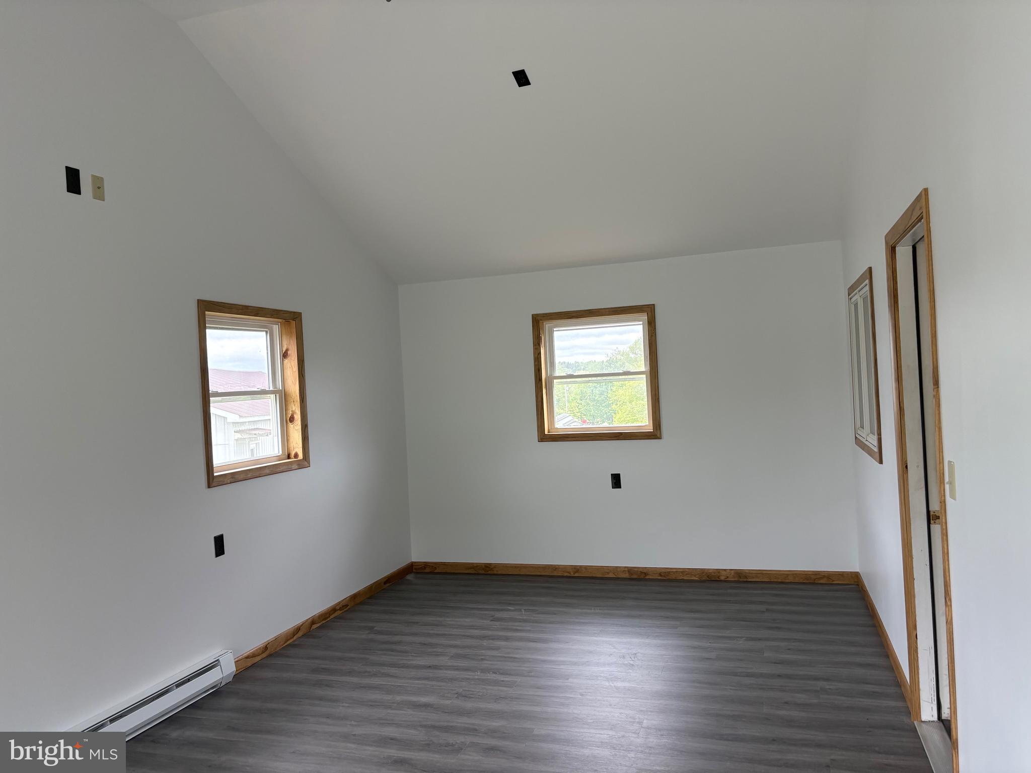 4319 Viola Pike Ramey, PA 16671 - Photo 6 of 23 a view of an empty room with wooden floor and a window