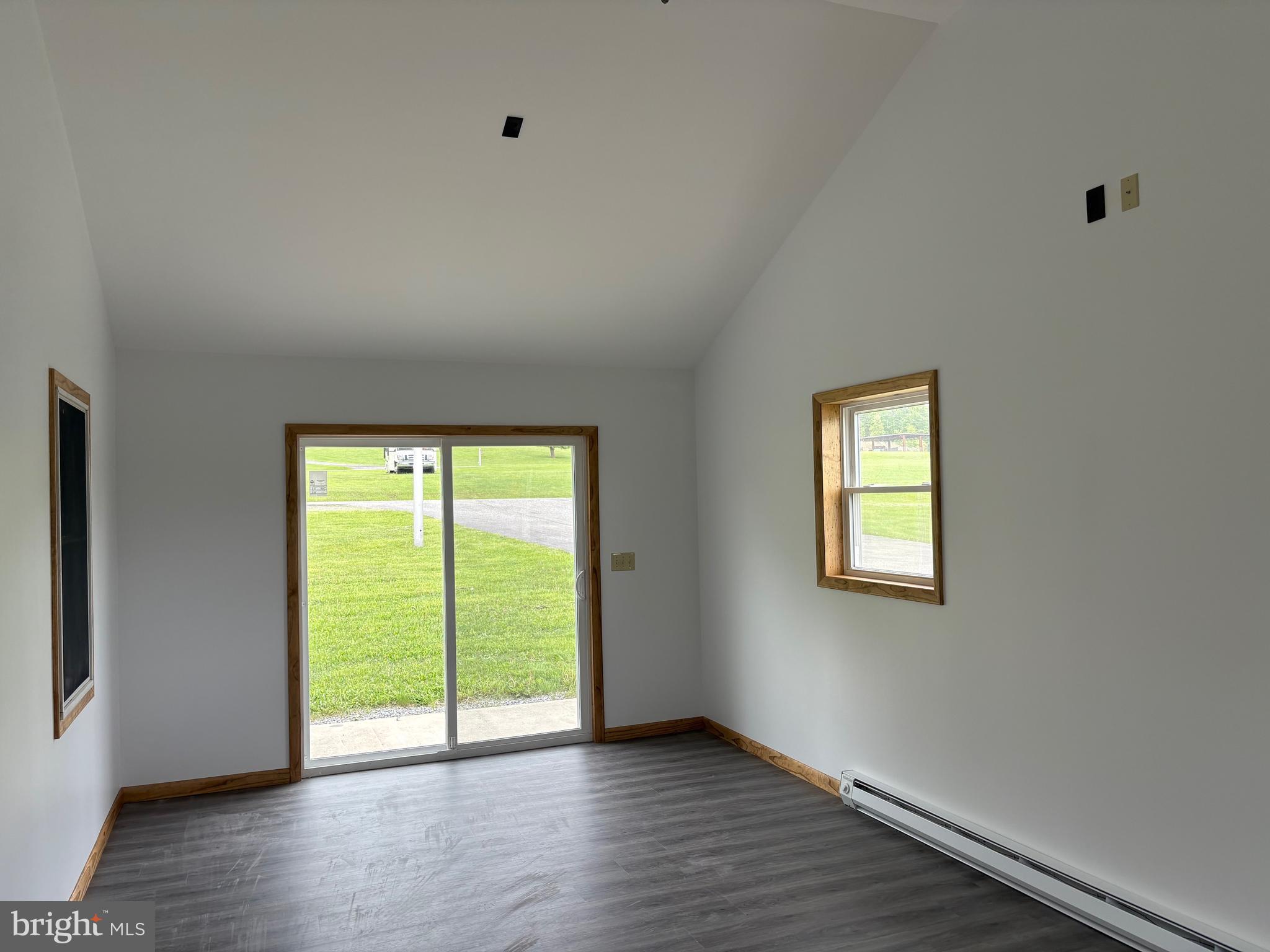 4319 Viola Pike Ramey, PA 16671 - Photo 7 of 23 a view of an empty room with wooden floor and a window