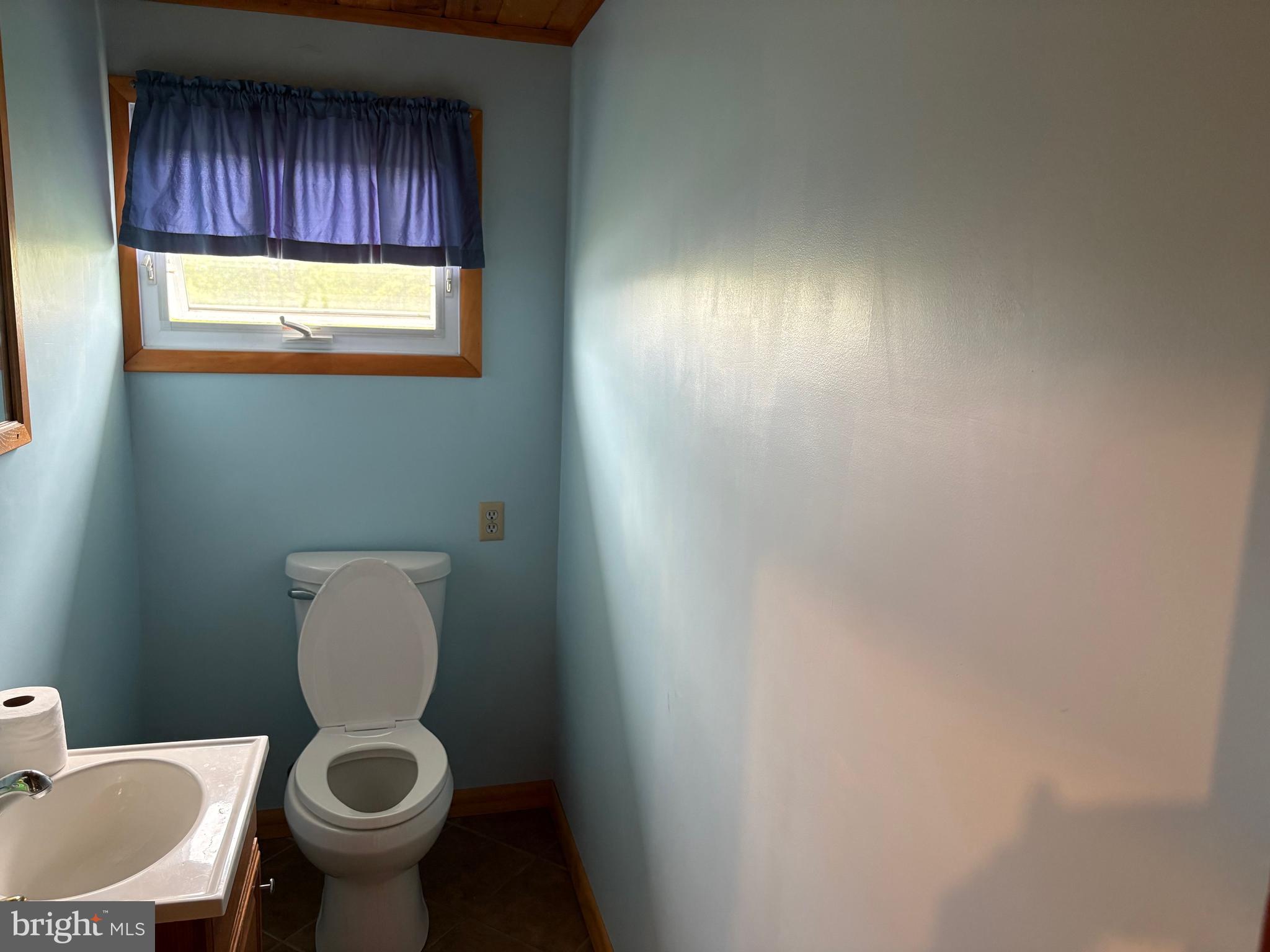 4319 Viola Pike Ramey, PA 16671 - Photo 10 of 23 a bathroom with a toilet sink and window