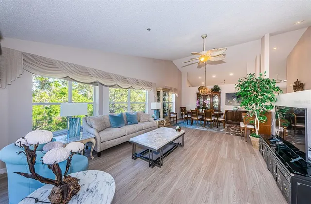 a living room with fireplace furniture and a flat screen tv