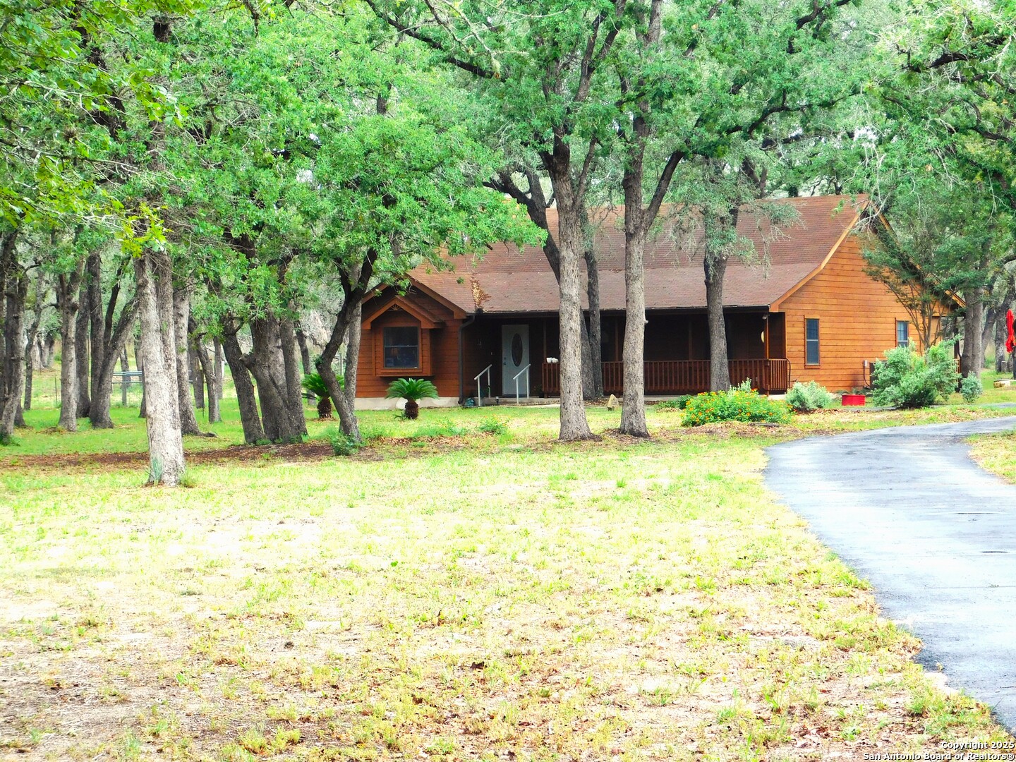 525 Cherry Ridge Floresville, TX 78114 - Photo 2 of 33 a front view of a house with a yard