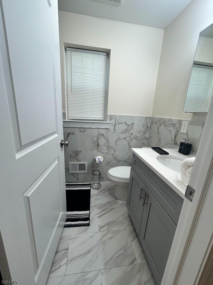 337 13th Avenue, Unit 1 Newark, NJ 07103 - Photo 9 of 14 a bathroom with a sink and a mirror