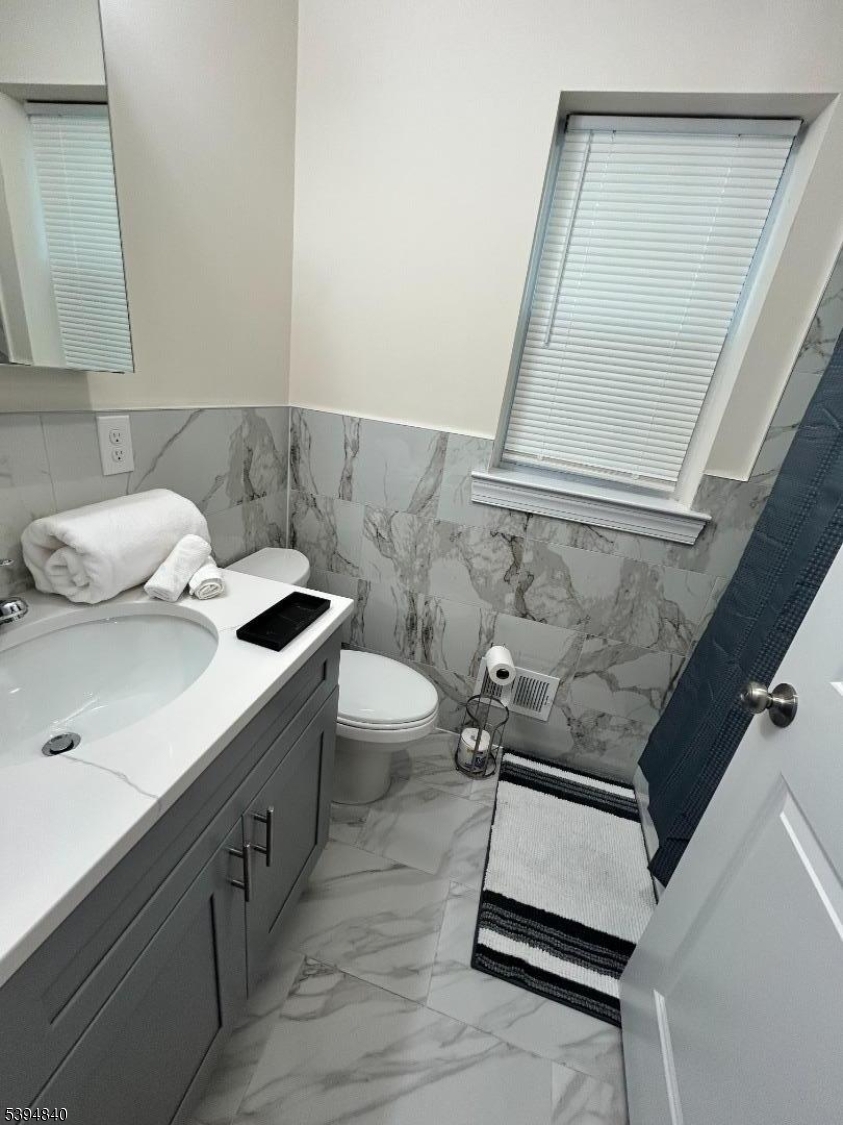 337 13th Avenue, Unit 1 Newark, NJ 07103 - Photo 10 of 14 a bathroom with a sink and a mirror