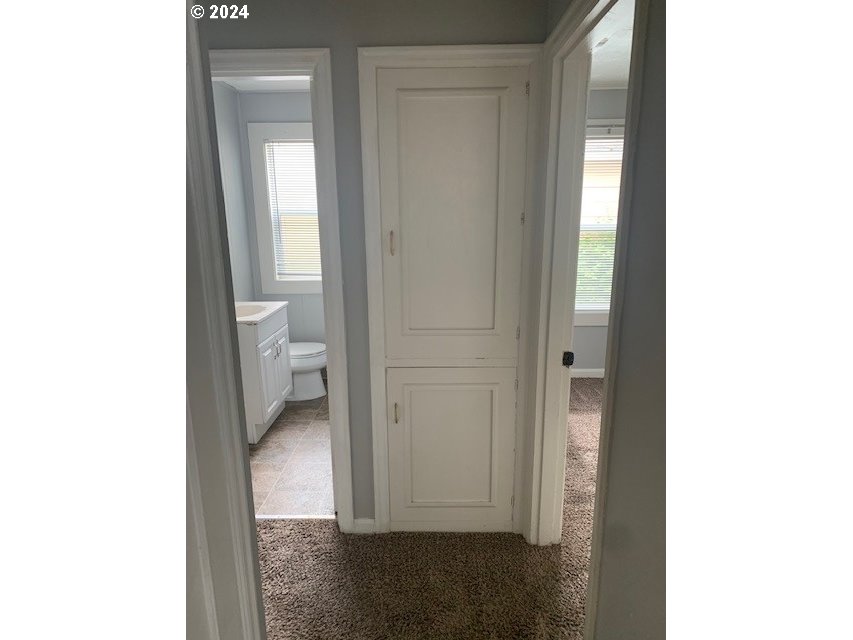 8445 Southeast Washington Street Portland, OR 97216 - Photo 13 of 17 a view of a bathroom with a toilet