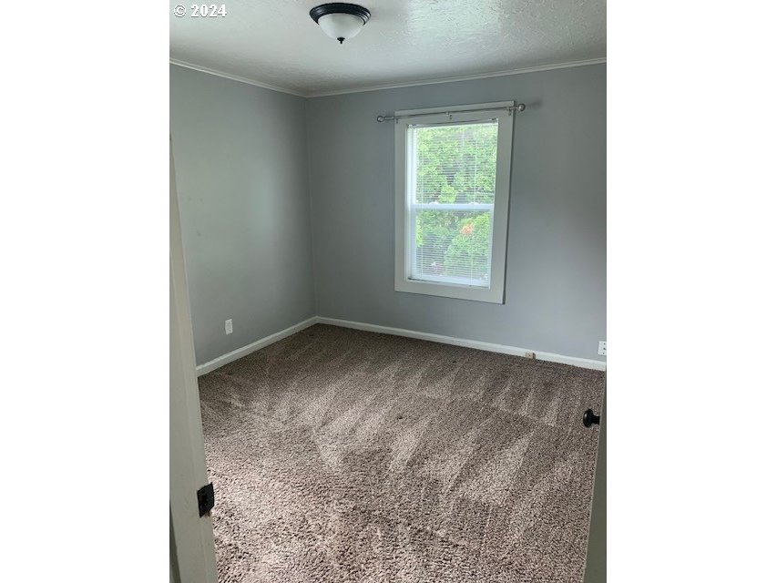 8445 Southeast Washington Street Portland, OR 97216 - Photo 14 of 17 a view of a room with a window