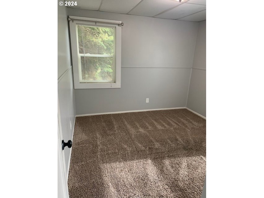 8445 Southeast Washington Street Portland, OR 97216 - Photo 16 of 17 a view of a small space with wooden floor and a window