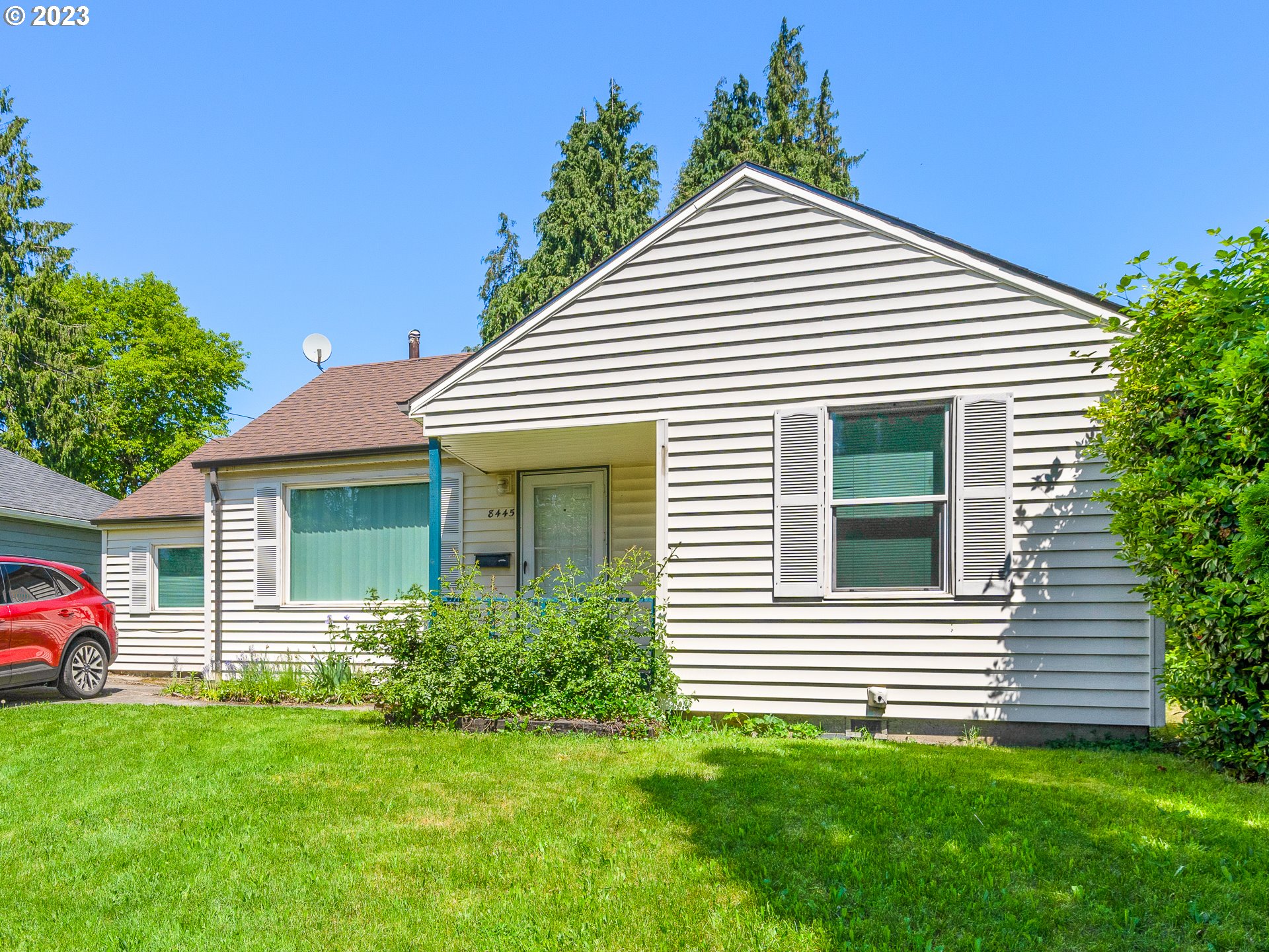8445 Southeast Washington Street Portland, OR 97216 - Photo 2 of 17 a view of a house with a yard