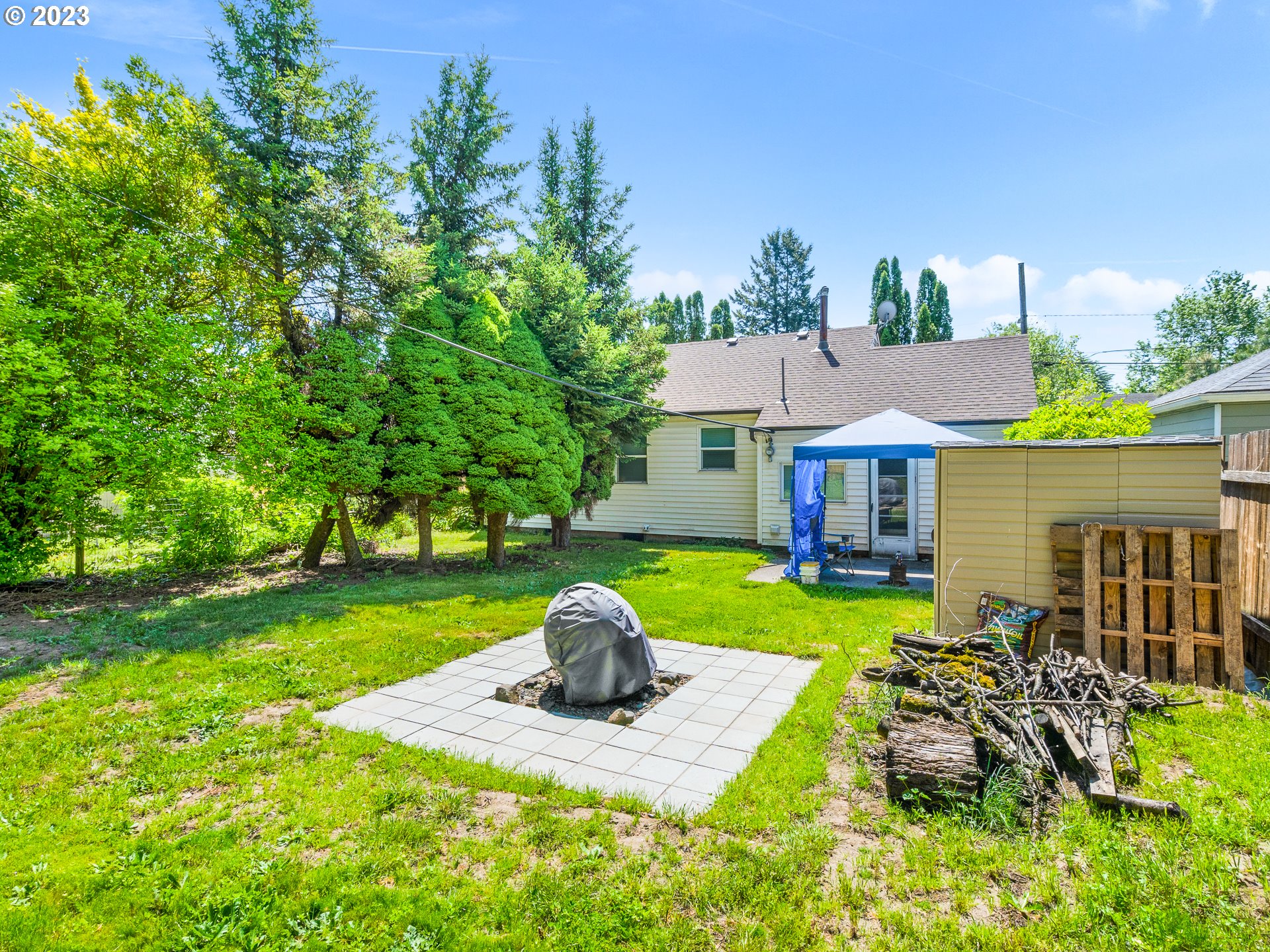 8445 Southeast Washington Street Portland, OR 97216 - Photo 3 of 17 a front view of house with yard and outdoor seating