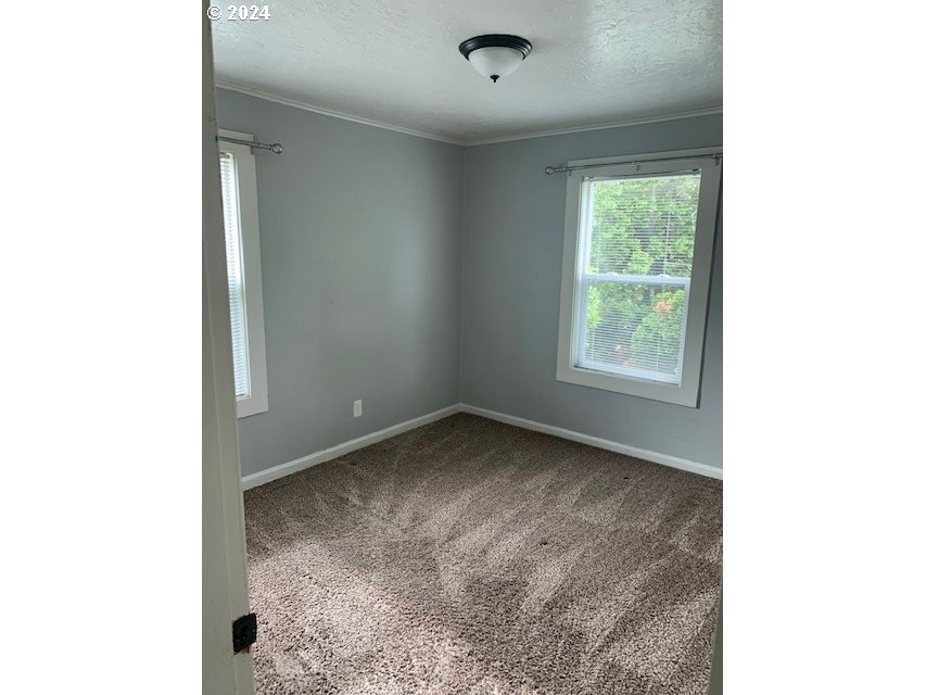 8445 Southeast Washington Street Portland, OR 97216 - Photo 8 of 17 a view of a room that has a window in it
