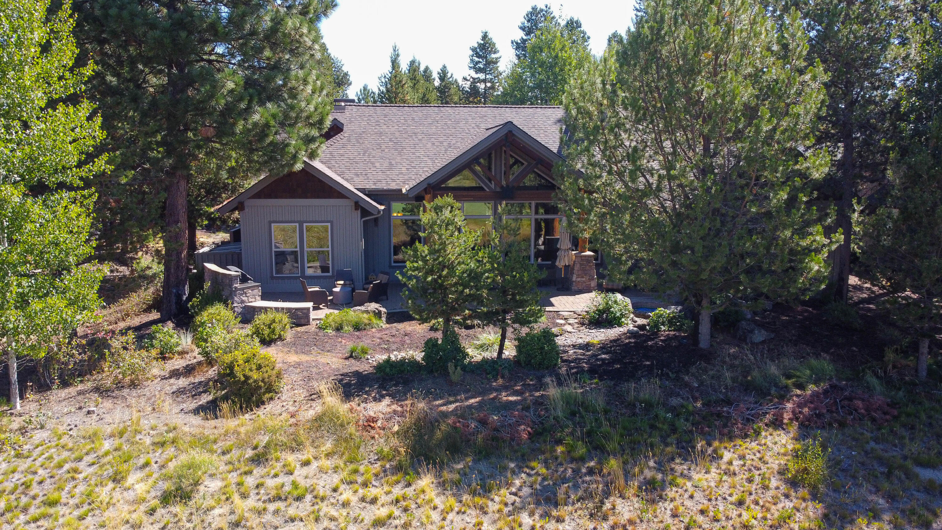 56689 Dancing Rock Loop Bend, OR 97707 - Photo 49 of 51 a view of a house with a yard and sitting area