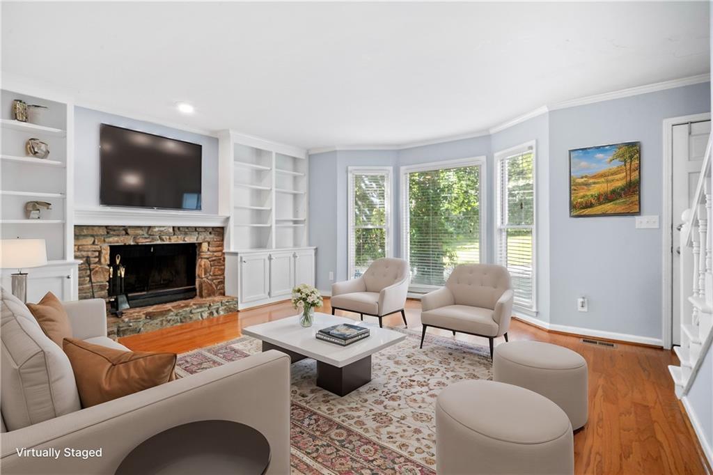 661 North Parkwood Road, Unit C Decatur, GA 30030 - Photo 1 of 14 a living room with furniture a flat screen tv and a fireplace