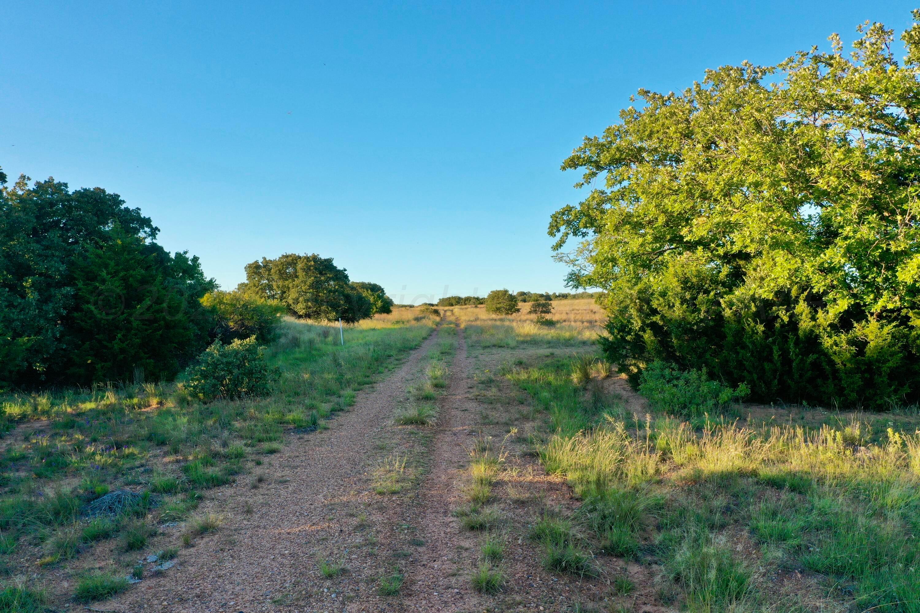 19 County Road 19 Wheeler, TX 79096 - Photo 36 of 57 a view of a lake with a yard