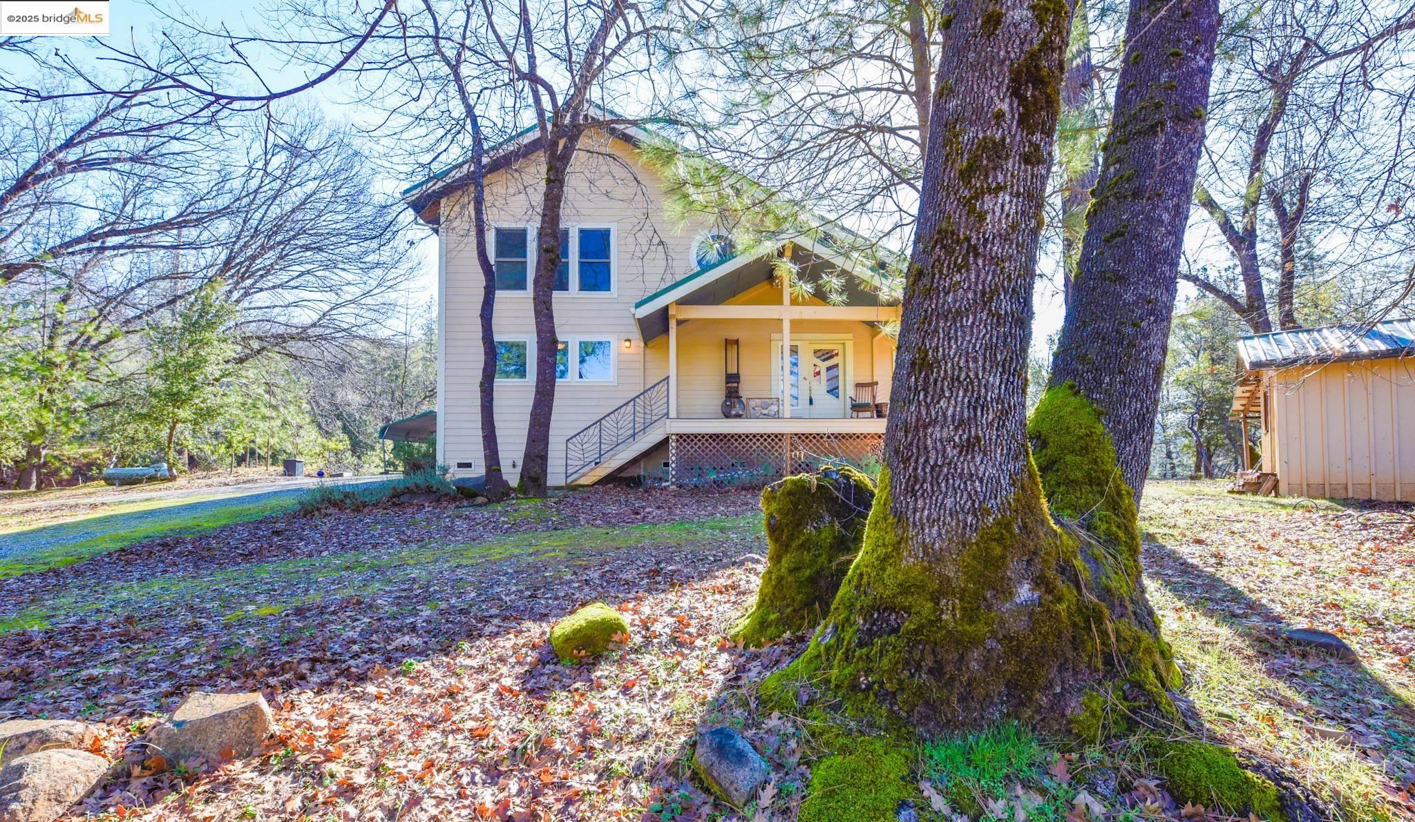 a front view of a house with garden
