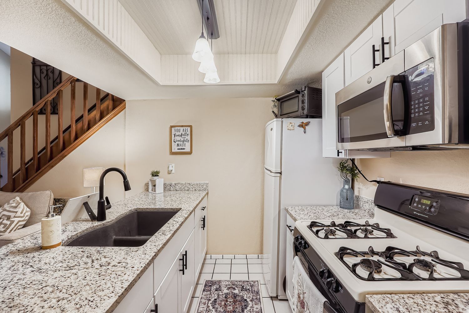 500 Hesters Crossing Road, Unit 310 Round Rock, TX 78681 - Photo 12 of 28 a kitchen with stainless steel appliances granite countertop a sink stove and refrigerator