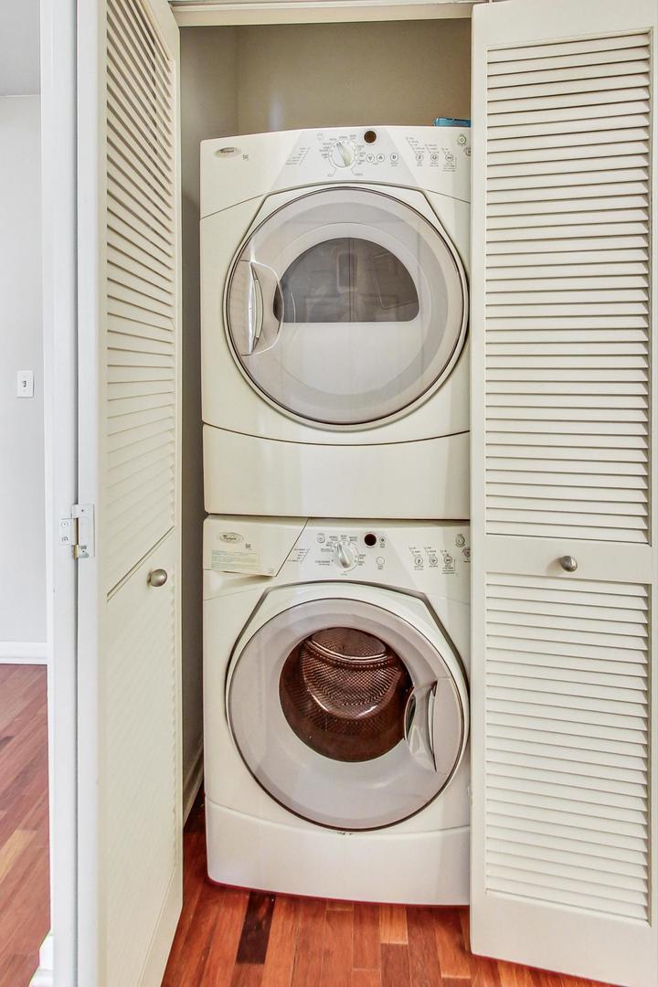 1255 South State Street, Unit 1918 Chicago, IL 60605 - Photo 14 of 16 a utility room with dryer and washer