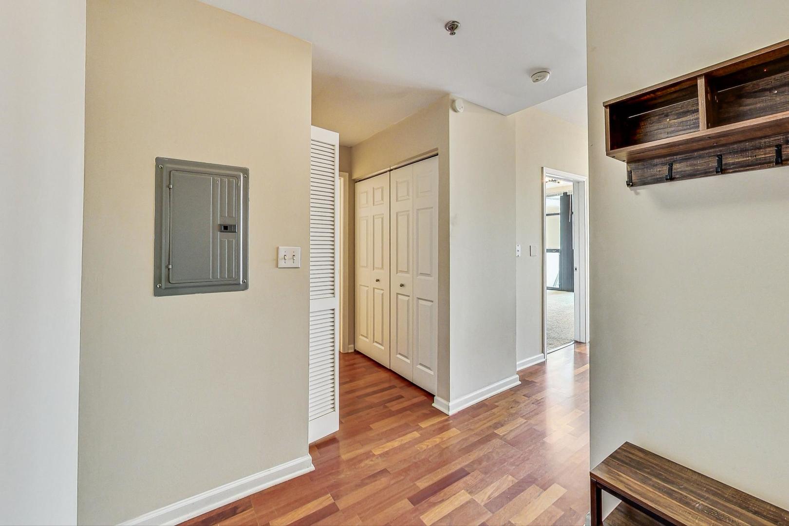1255 South State Street, Unit 1918 Chicago, IL 60605 - Photo 3 of 16 a view of a hallway with wooden floor