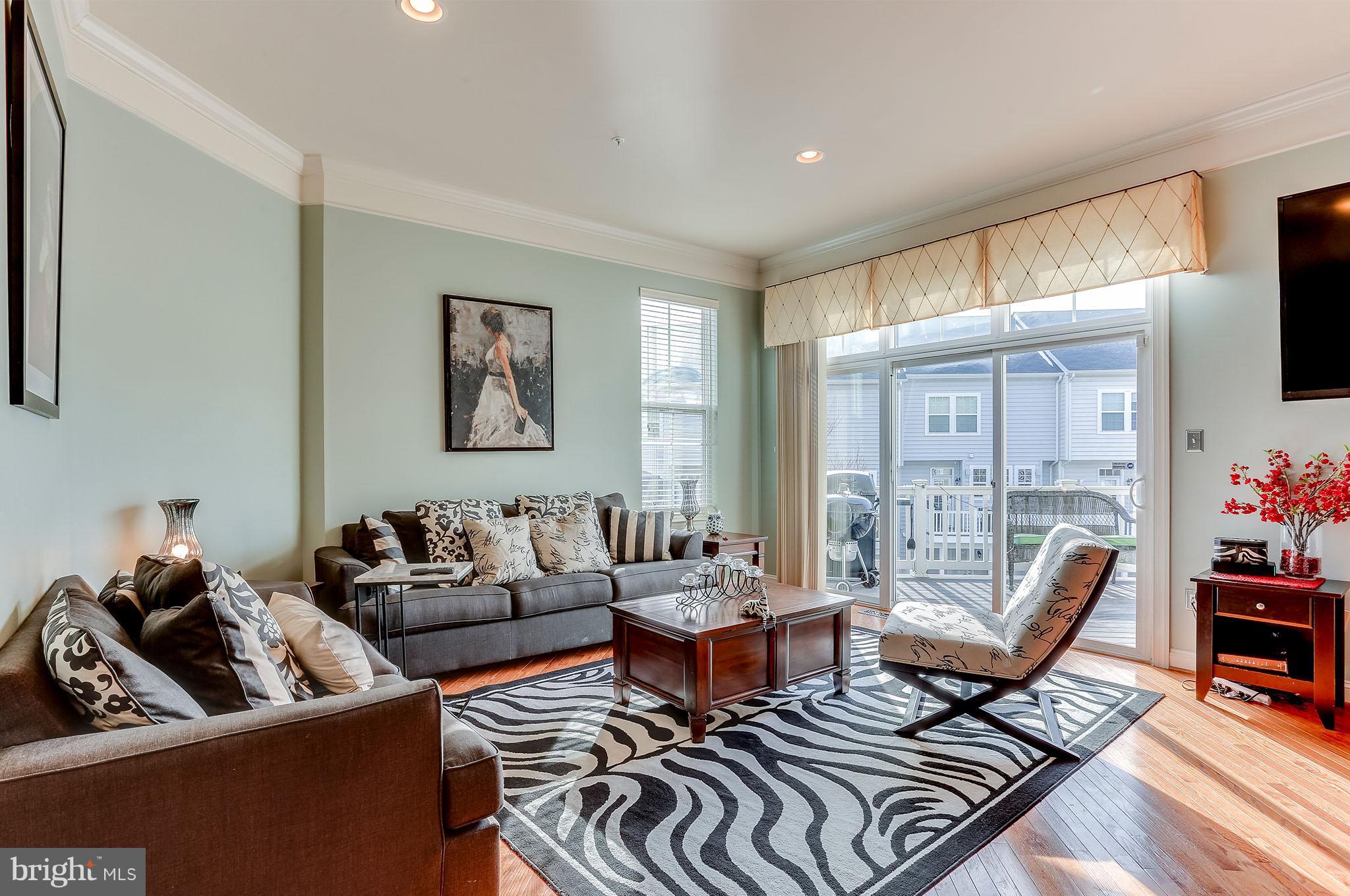 9821 Garden Ranges Laurel, MD 20723 - Photo 8 of 29 Family room off kitchen w/slider to deck