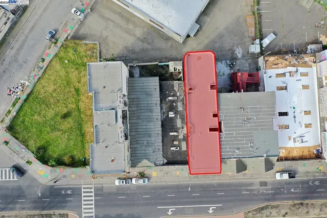 aerial view of a house with a street