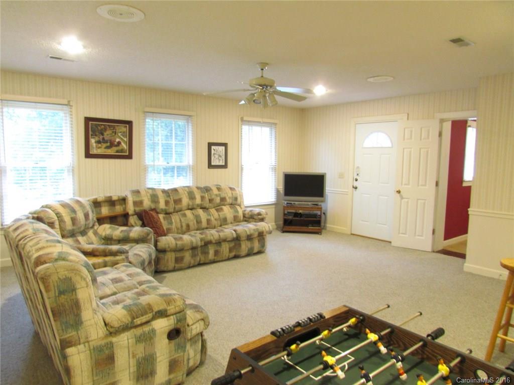 335 Gregory Road Salisbury, NC 28147 - Photo 14 of 24 a living room with furniture and a flat screen tv
