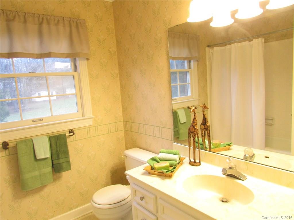 335 Gregory Road Salisbury, NC 28147 - Photo 22 of 24 a bathroom with a granite countertop sink toilet and shower