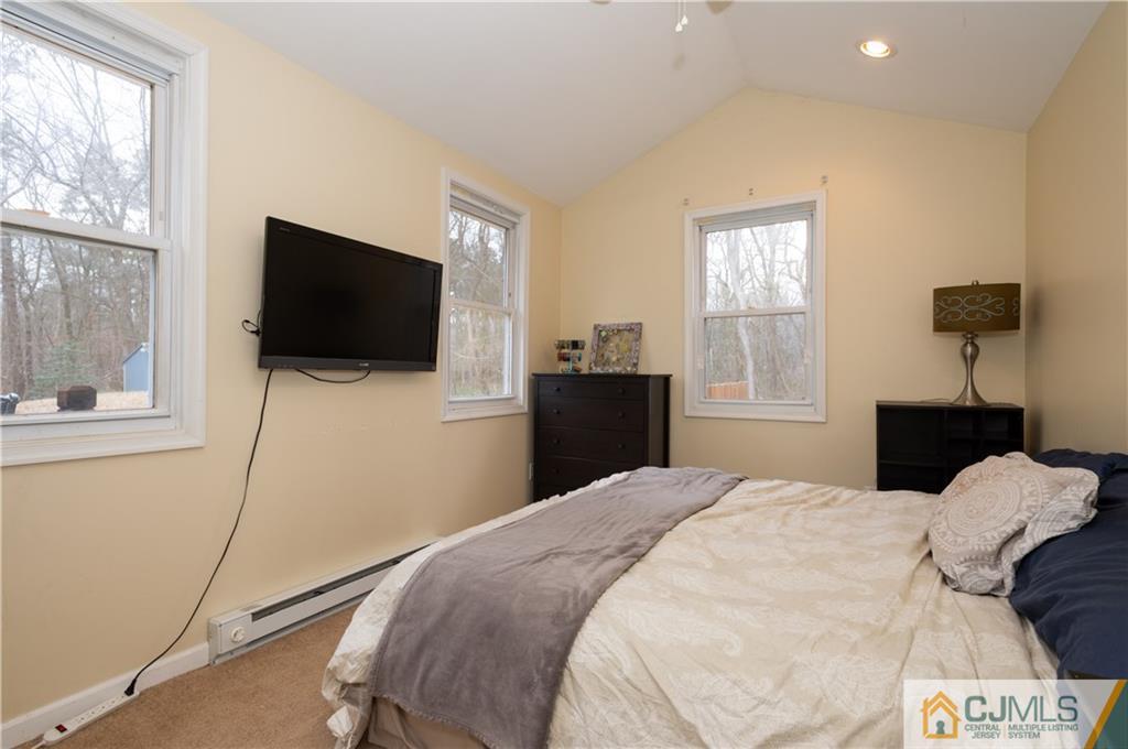 10 Soden Lane Old Bridge, NJ 08857 - Photo 12 of 20 a bedroom with a bed and a flat screen tv