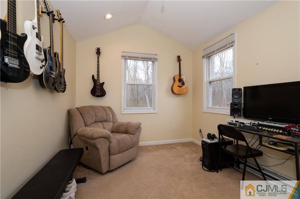 10 Soden Lane Old Bridge, NJ 08857 - Photo 13 of 20 a living room with furniture and a flat screen tv