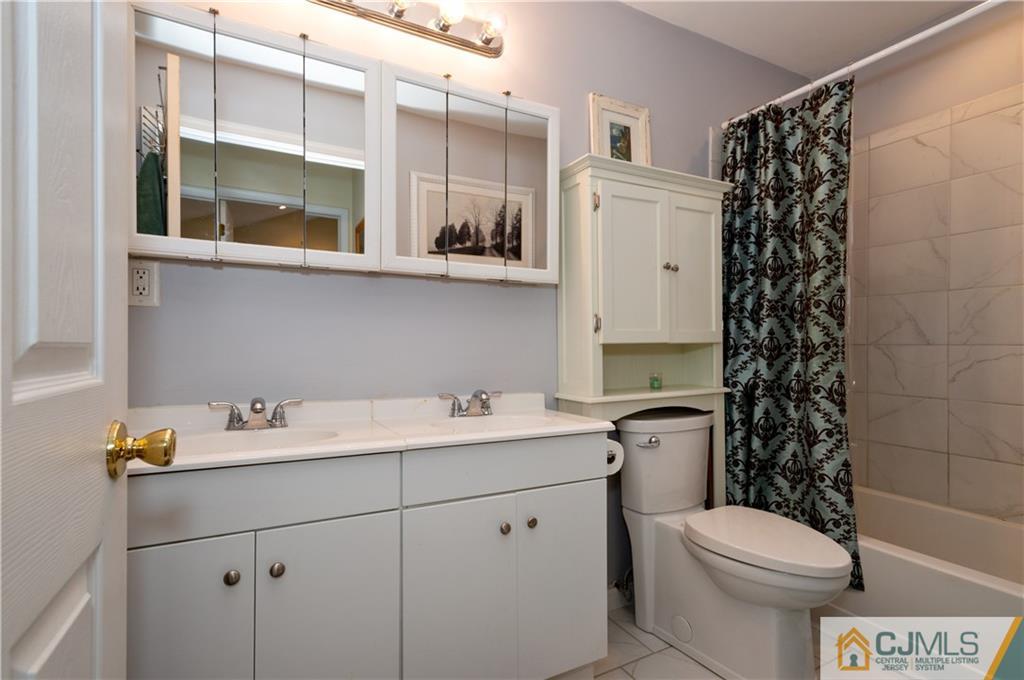10 Soden Lane Old Bridge, NJ 08857 - Photo 14 of 20 a bathroom with a sink toilet vanity and shower