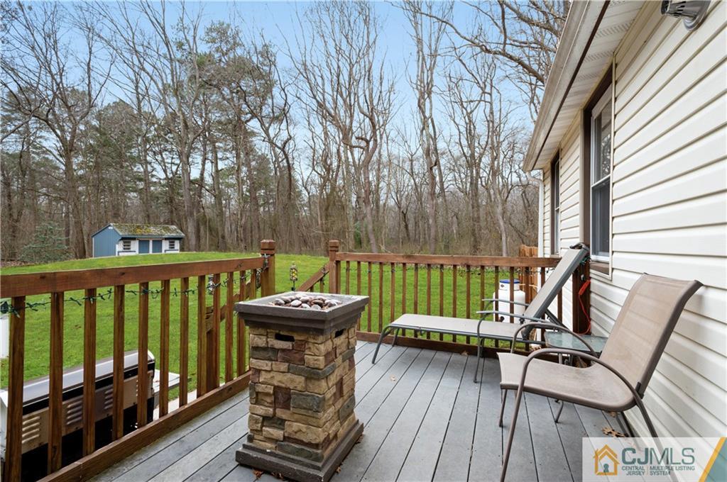 10 Soden Lane Old Bridge, NJ 08857 - Photo 16 of 20 a view of a two chairs and table on the wooden floor
