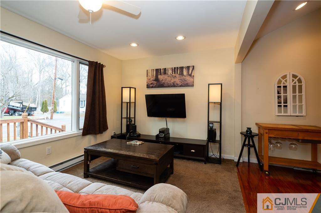10 Soden Lane Old Bridge, NJ 08857 - Photo 3 of 20 a living room with furniture and a flat screen tv