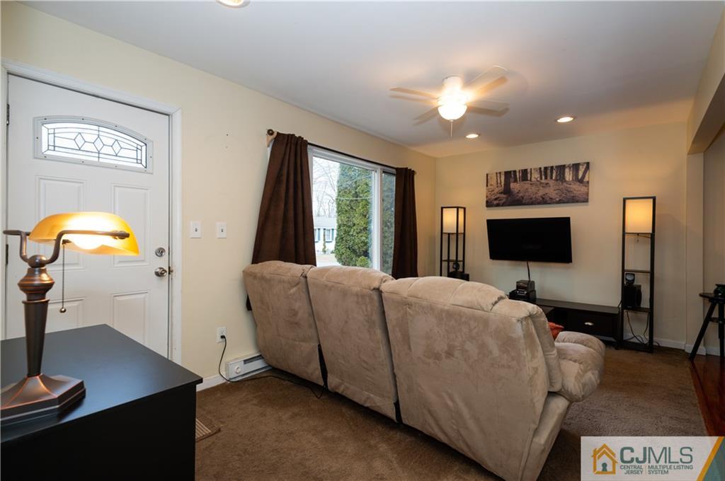 10 Soden Lane Old Bridge, NJ 08857 - Photo 4 of 20 a living room with furniture and a flat screen tv