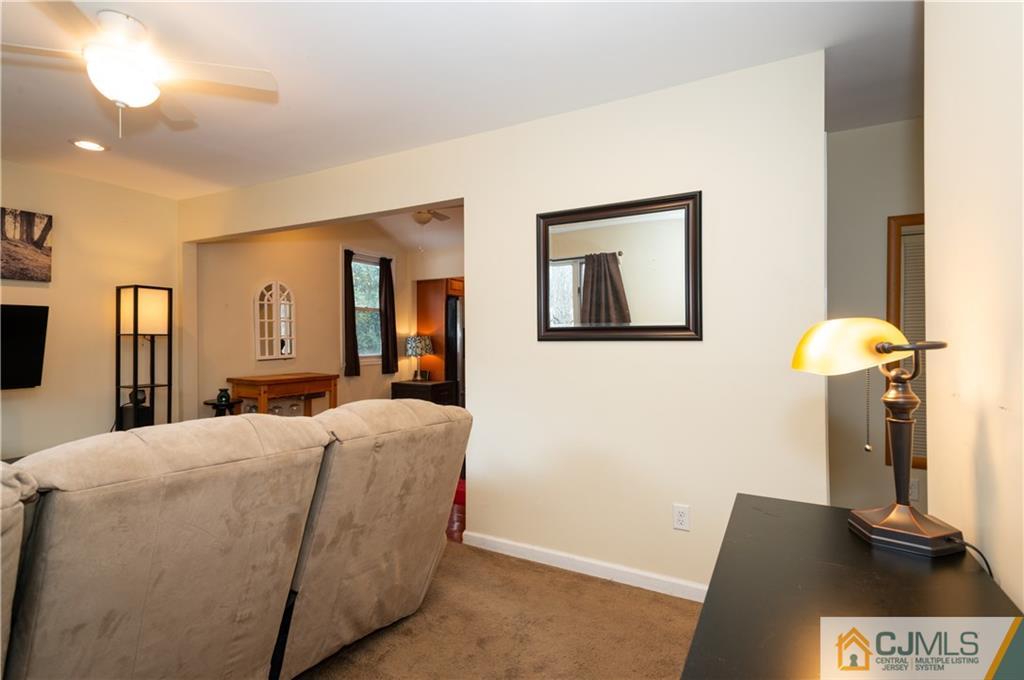 10 Soden Lane Old Bridge, NJ 08857 - Photo 5 of 20 a living room with a couch and a flat screen tv