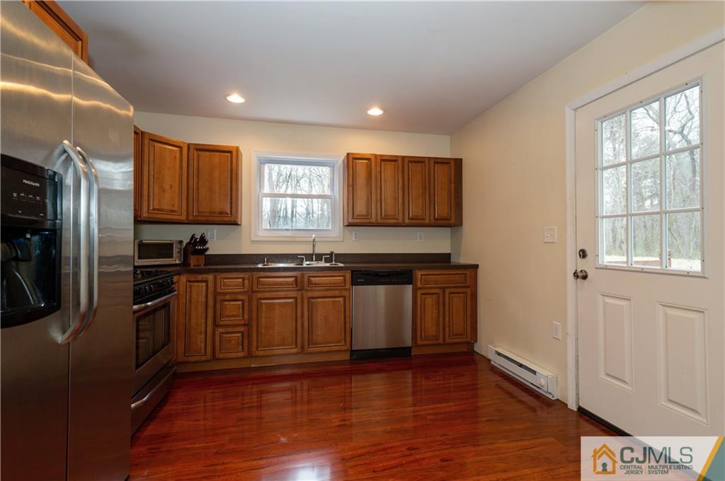 10 Soden Lane Old Bridge, NJ 08857 - Photo 6 of 20 a kitchen with stainless steel appliances granite countertop a refrigerator and a stove top oven