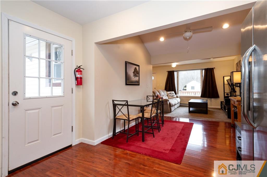 10 Soden Lane Old Bridge, NJ 08857 - Photo 9 of 20 a living room with furniture a wooden floor and next to a window